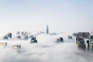 business district skyline above the clouds