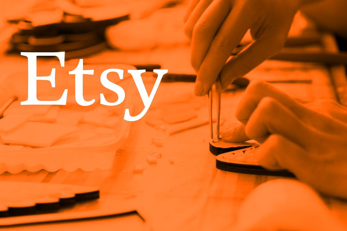 Etsy logo with orange background showing craft person making product