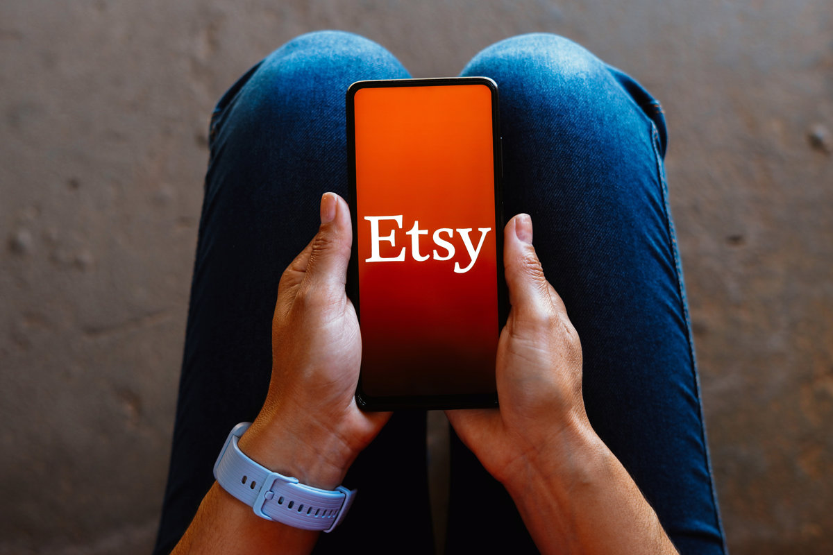 Etsy logo is displayed on a smartphone mobile screen